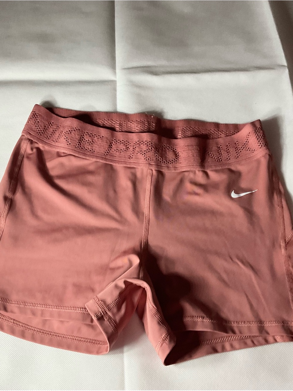 Nike Women's Mauve Pink Bike Shorts with White Swoosh